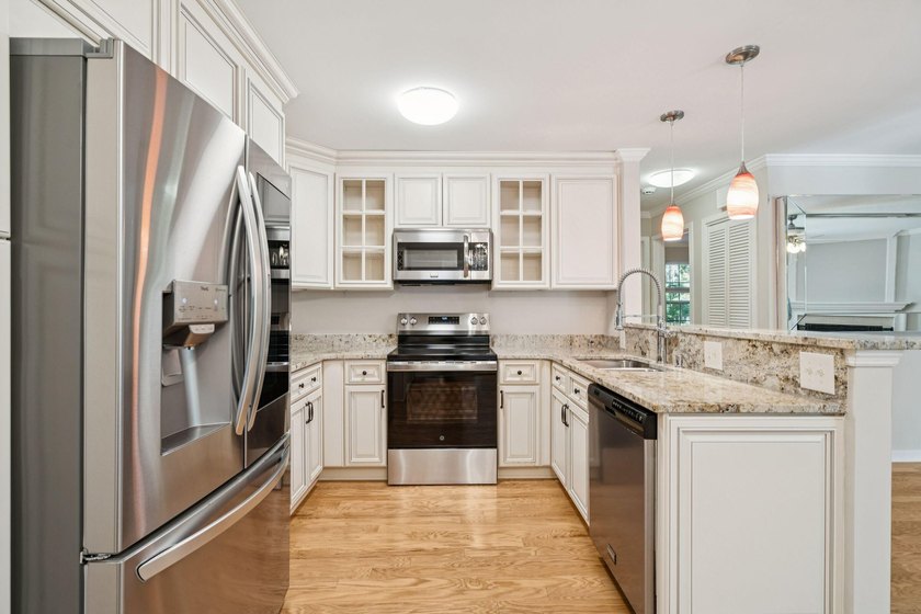 This first floor condo in a gated community with tons of - photo 2