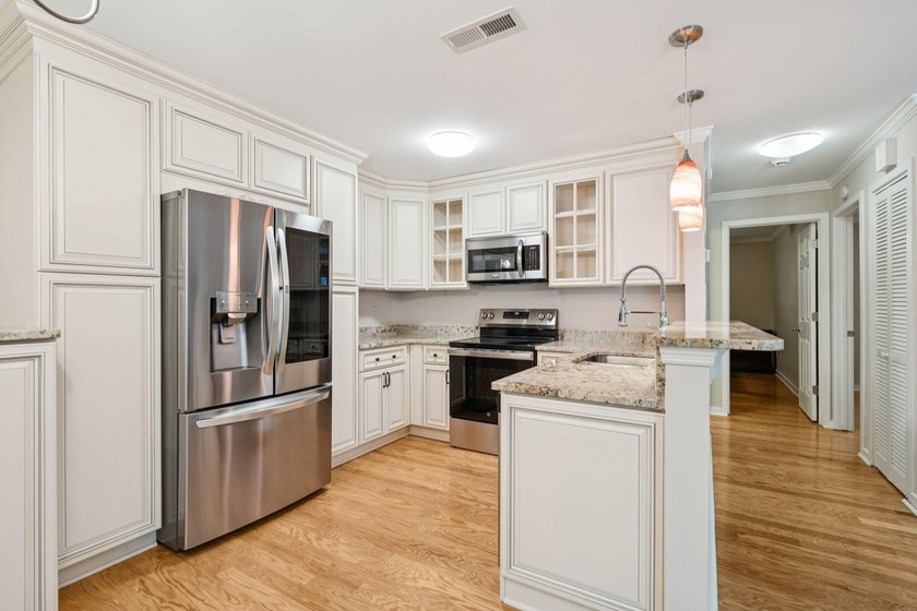This first floor condo in a gated community with tons of - photo 3