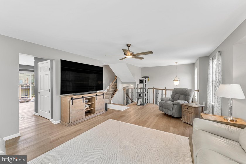 Welcome to this beautifully maintained end-unit townhome in the - photo 2