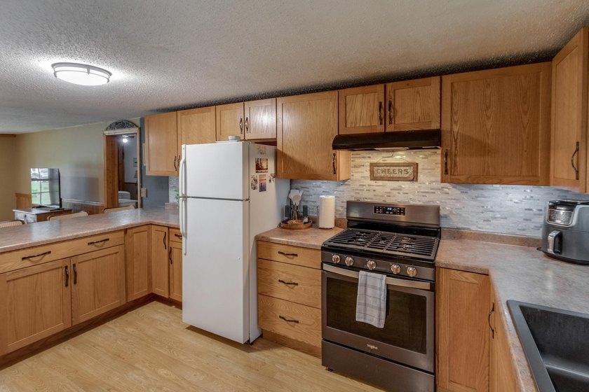 Towering mature pine trees on 5 private acres, this beautiful - photo 4