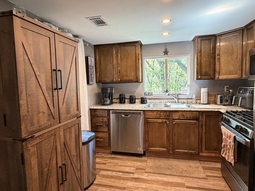 Completely remodeled and move-in ready, this quaint home blends - photo 22