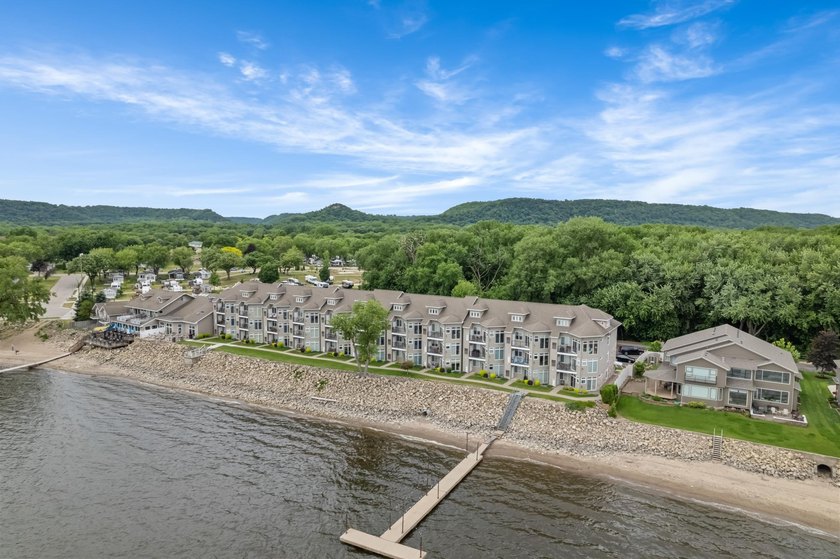 --Enjoy breathtaking views of this rare waterfront lake and - photo 5