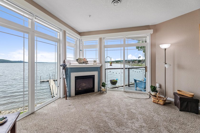 --Enjoy breathtaking views of this rare waterfront lake and - photo 7