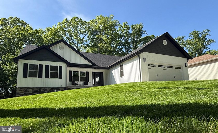 Nestled in the prestigious Lake of the Woods community, this - photo 3