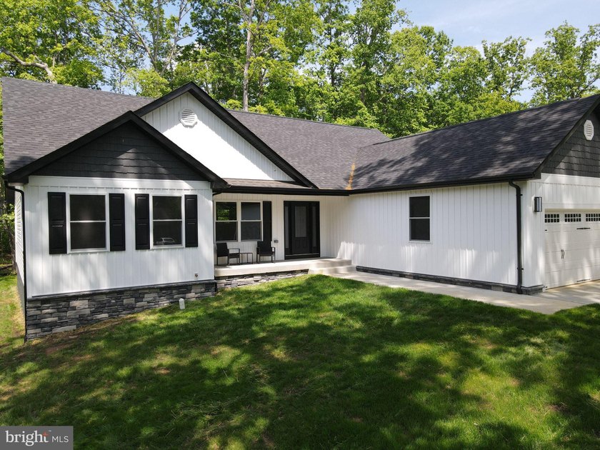 Nestled in the prestigious Lake of the Woods community, this - photo 7