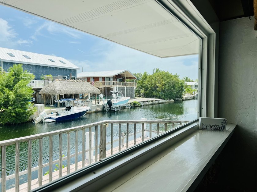 Bring your boats to this beautifully furnished canal front home - photo 10