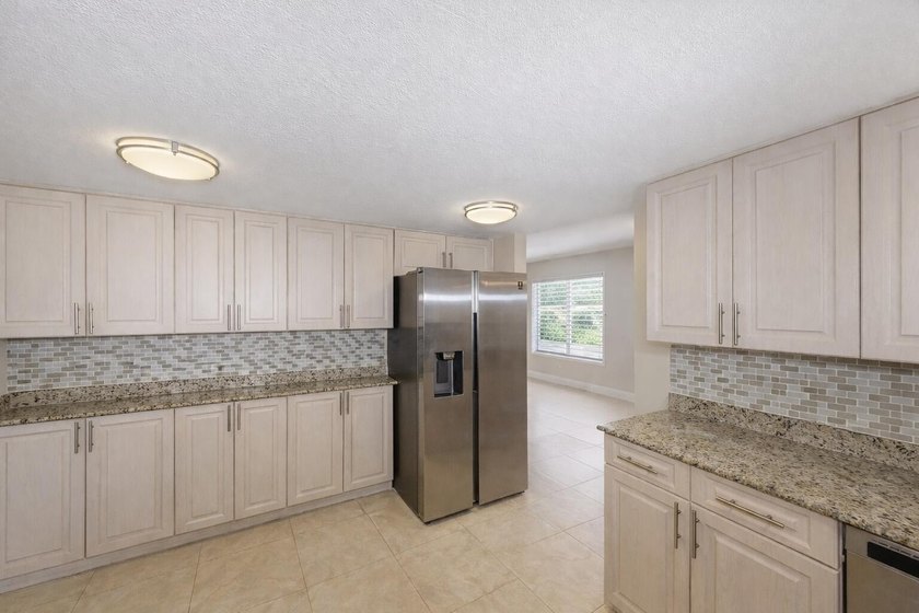Welcome to this beautifully refreshed pool home located in the - photo 19