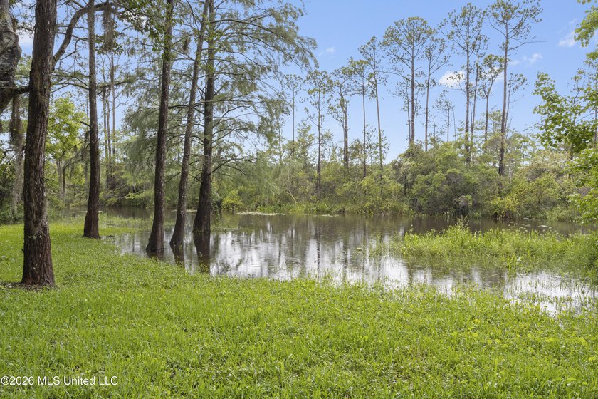 Enjoy waterfront living in this 3-bedroom, 2-bath home located - photo 27