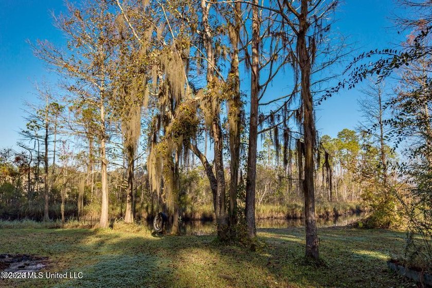 Enjoy waterfront living in this 3-bedroom, 2-bath home located - photo 30