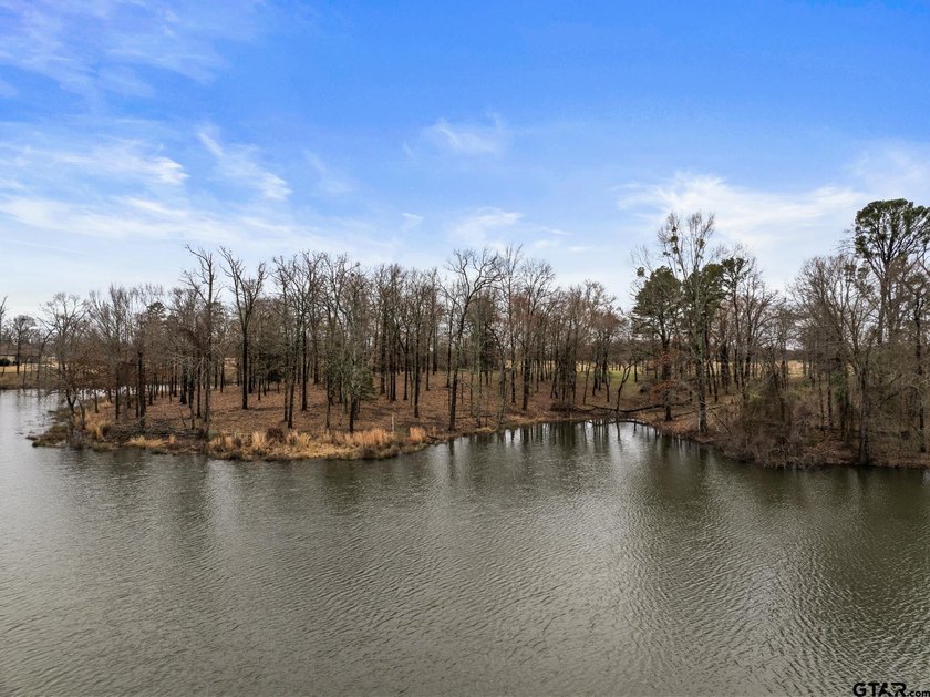 Discover the perfect waterfront retreat with this 1.09 +/- acre - photo 9