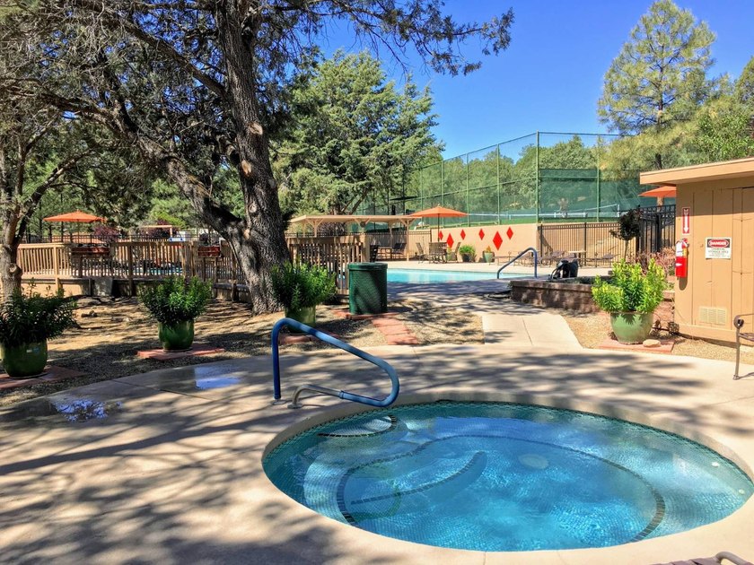 Just steps from the pool, pickleball courts and lakes, this cozy - photo 25