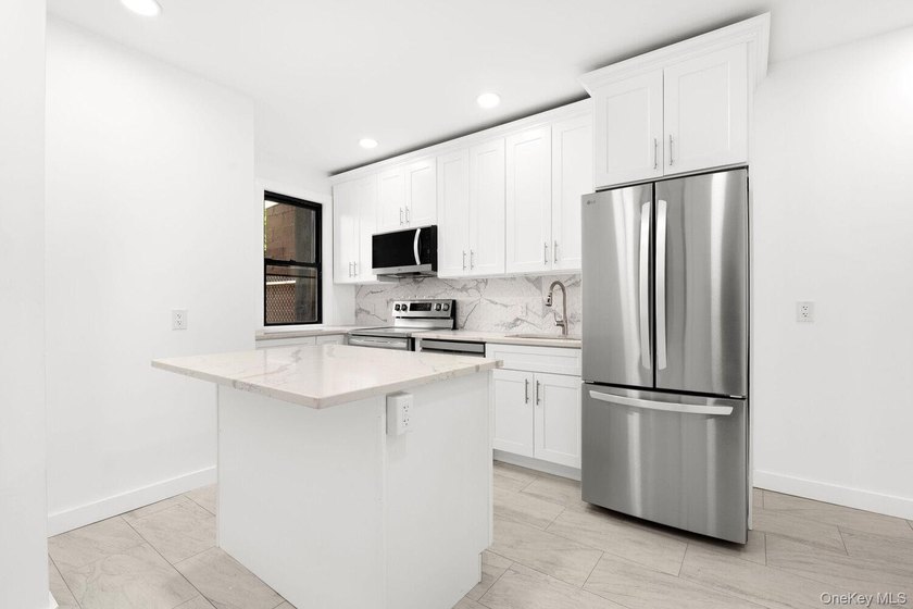 Welcome to 346 E 53rd St., a beautifully renovated semi-detached - photo 3