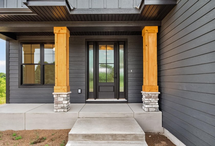 Experience luxury living in this custom-built two-story home by - photo 2