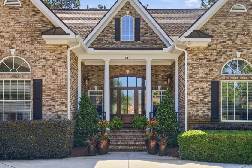 Set on the 11th fairway of The Reserve, 681 Reserve Drive is an - photo 9
