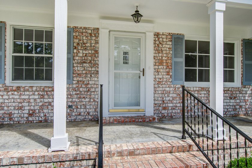 Welcome to this charming 3-bedroom brick ranch nestled on a - photo 4