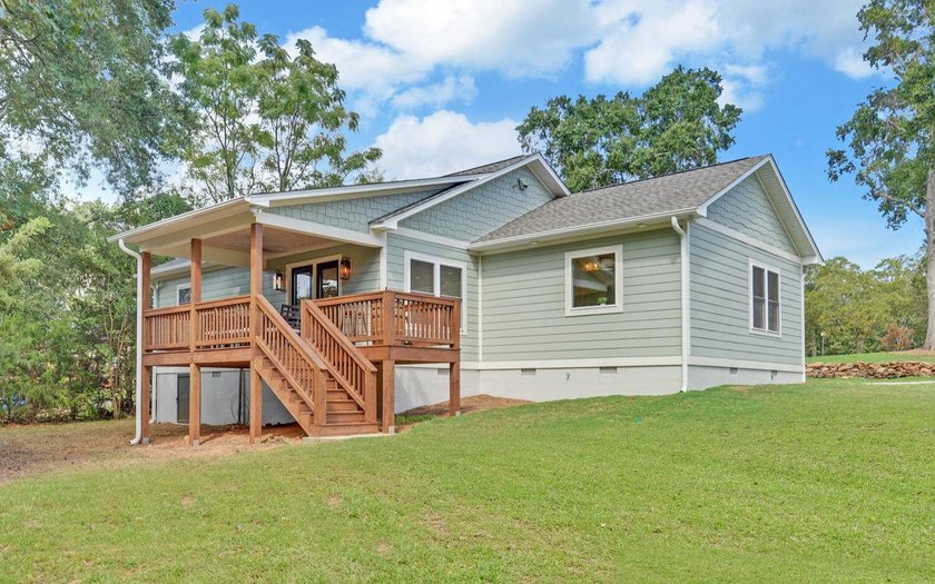Waterfront with 1.4 acres of land, dock, remodeled house with - photo 31