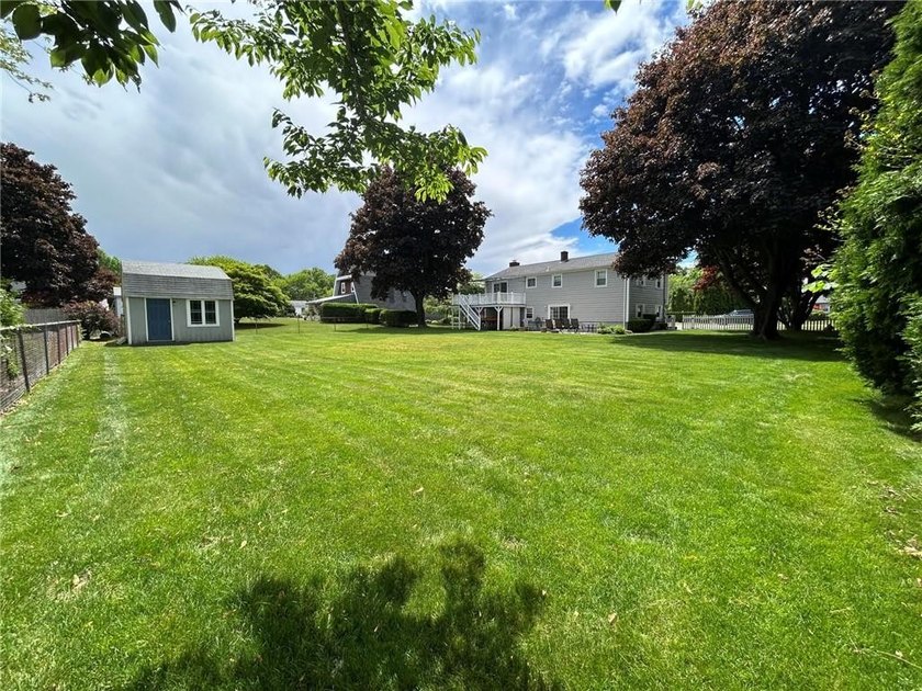 Discover the potential of this raised ranch located in the - photo 2