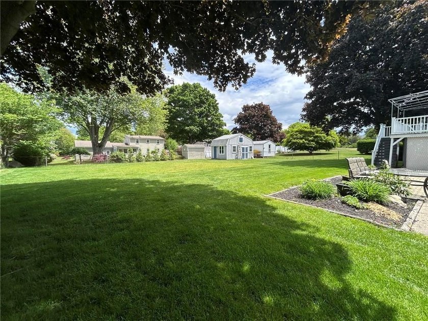 Discover the potential of this raised ranch located in the - photo 3