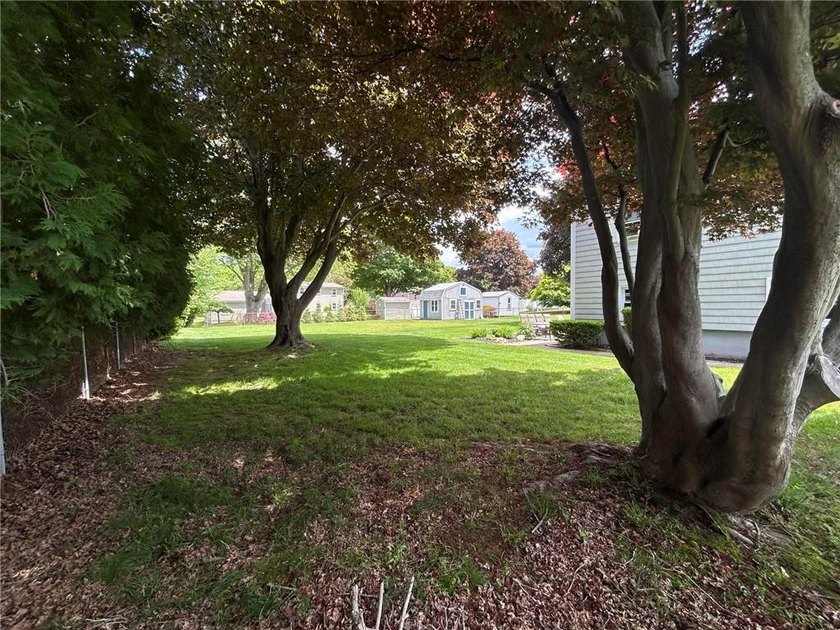Discover the potential of this raised ranch located in the - photo 4