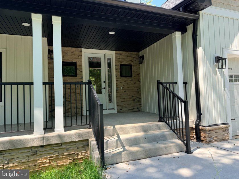 Nestled in the prestigious Lake of the Woods community, this - photo 2