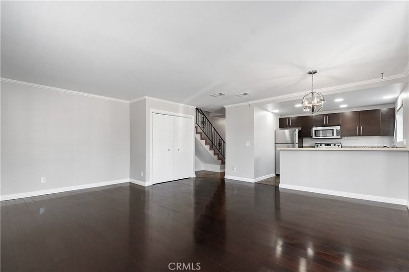 This two-story, townhouse-style condominium offers two primary - photo 8