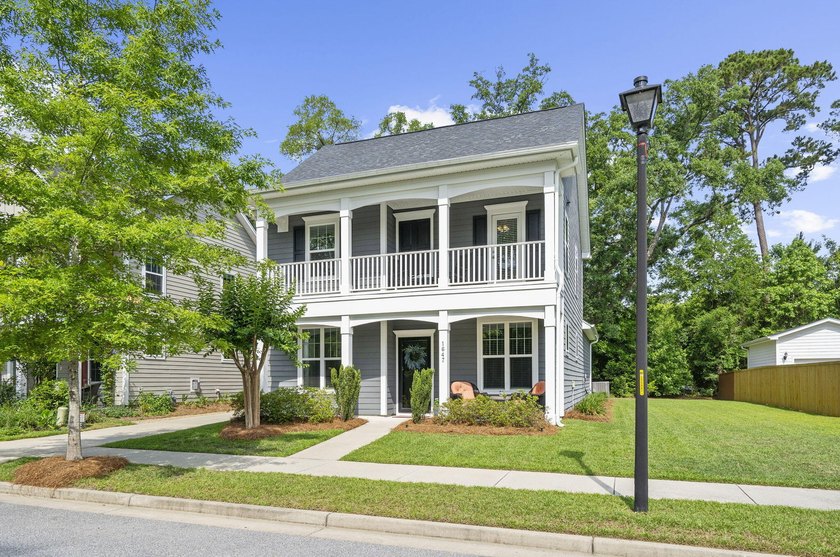 Welcome to this charming Charleston-style home in the highly - photo 2