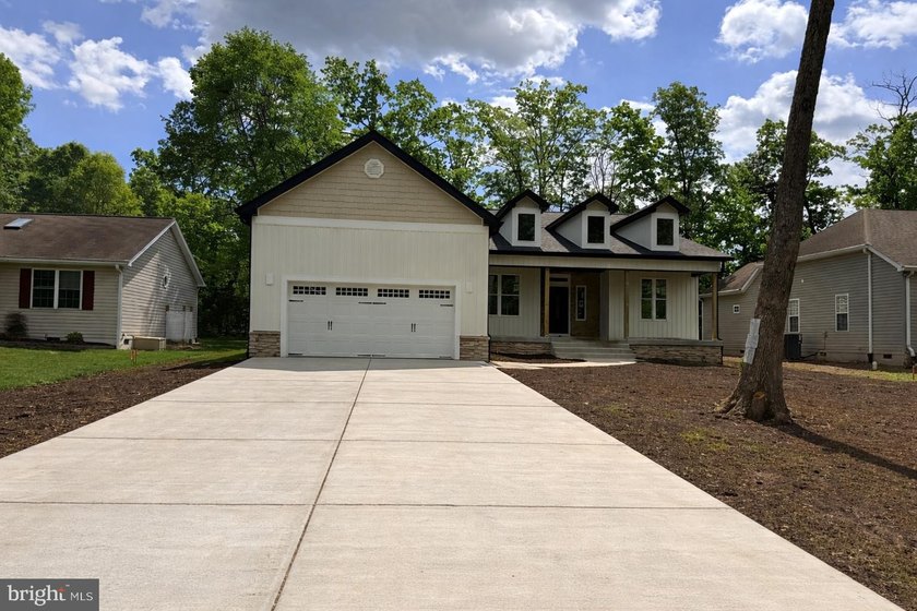 Nestled in the prestigious Lake of the Woods community, this - photo 2