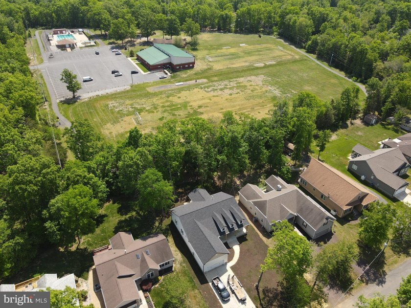 Nestled in the prestigious Lake of the Woods community, this - photo 9