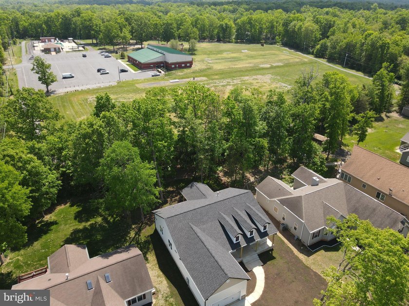 Nestled in the prestigious Lake of the Woods community, this - photo 10