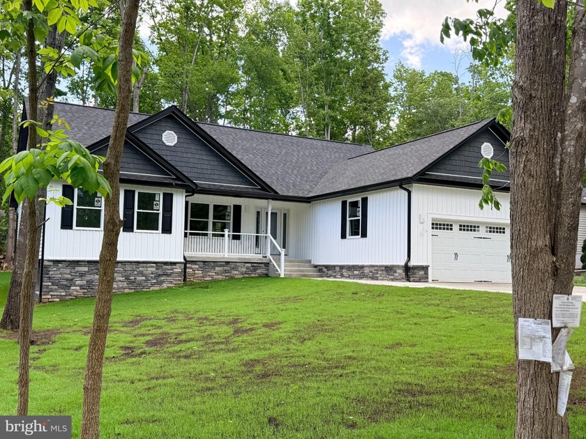 Nestled in the prestigious Lake of the Woods community, this - photo 2