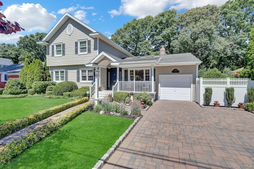 Welcome to this beautifully expanded ranch nestled in one of the - photo 3