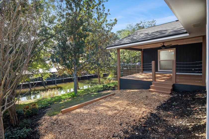75' of canal frontage sets the stage for easy waterfront living - photo 32