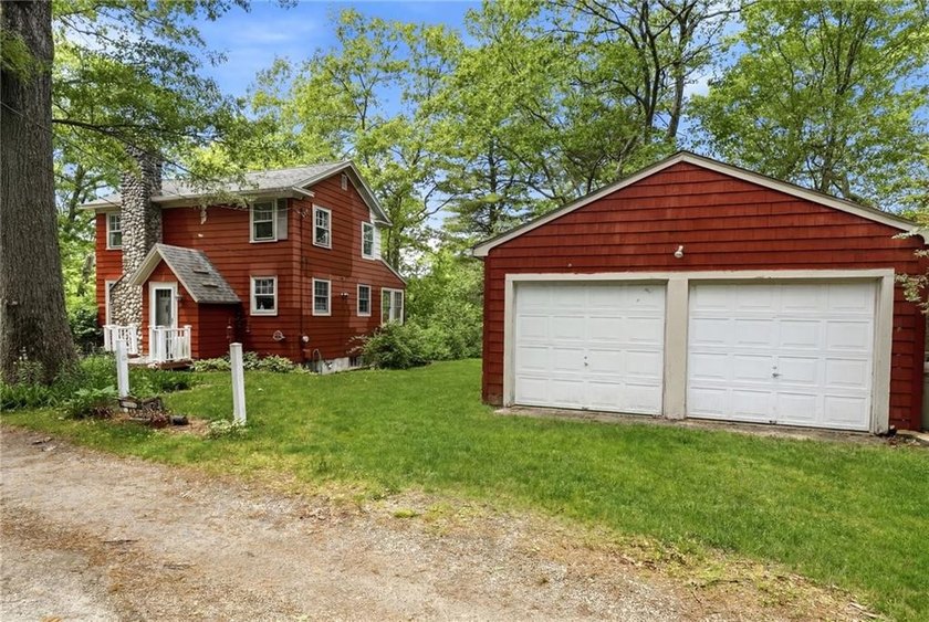 Set on nearly an acre in North Kingstown, this 3-bedroom, 1-bath - photo 4