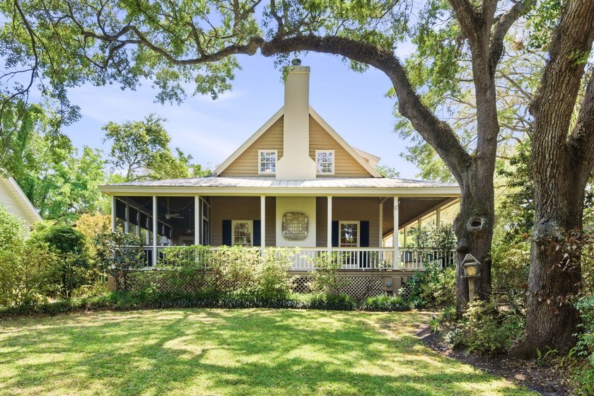 Located beneath breathtaking live oaks in the heart of the - photo 3