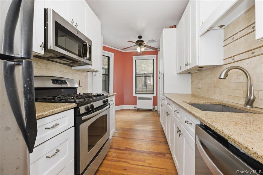Classic Pre-War Charm Meets Modern Living at 3875 Waldo Avenue - photo 8