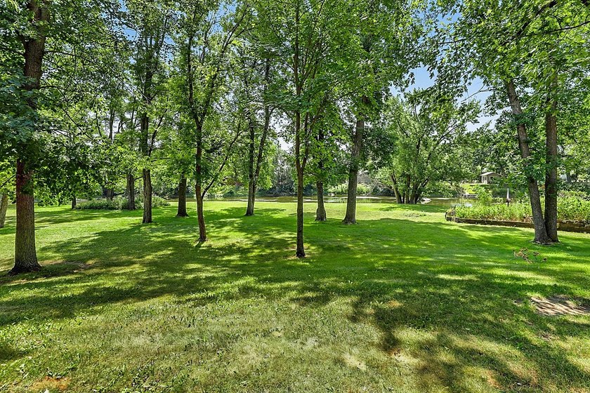 This unique riverfront property offers several hundred ft of - photo 2