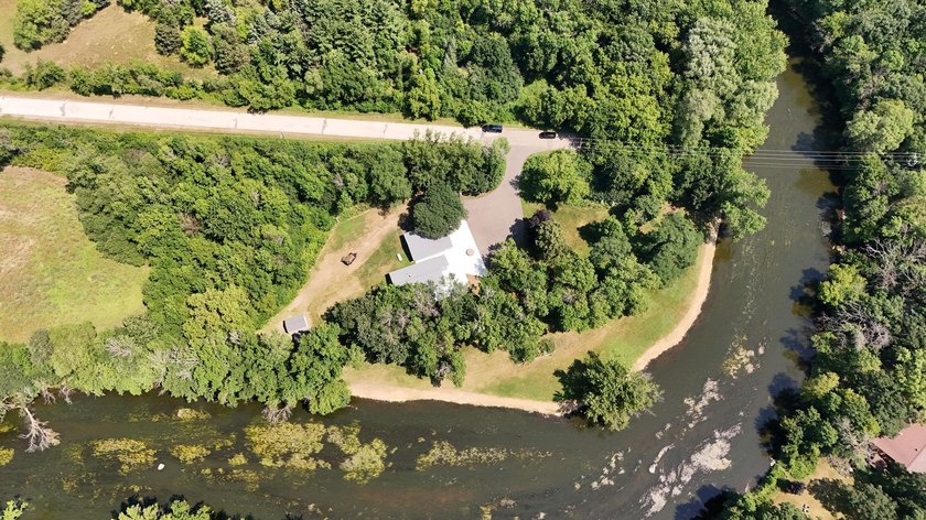 This unique riverfront property offers several hundred ft of - photo 4