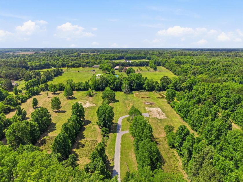 Welcome to this expansive 12.25-acre property in the heart of - photo 2