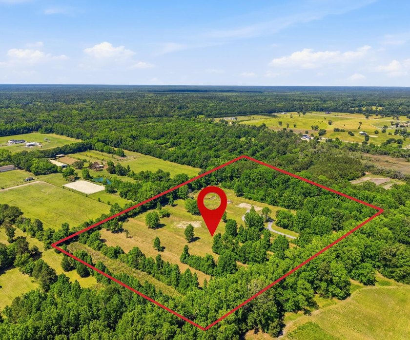 Welcome to this expansive 12.25-acre property in the heart of - photo 5