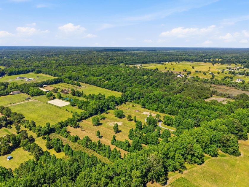 Welcome to this expansive 12.25-acre property in the heart of - photo 6
