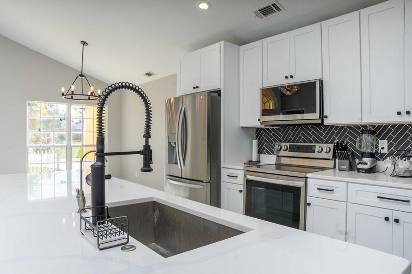 Discover this amazing home Pool home featuring 3 bedrooms, 2 - photo 7