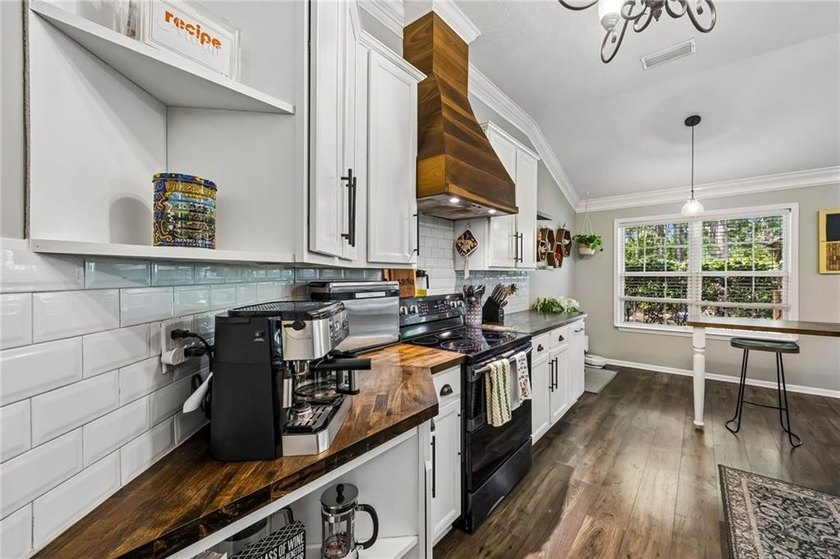 This custom-built home is situated on a private, wooded homesite - photo 22