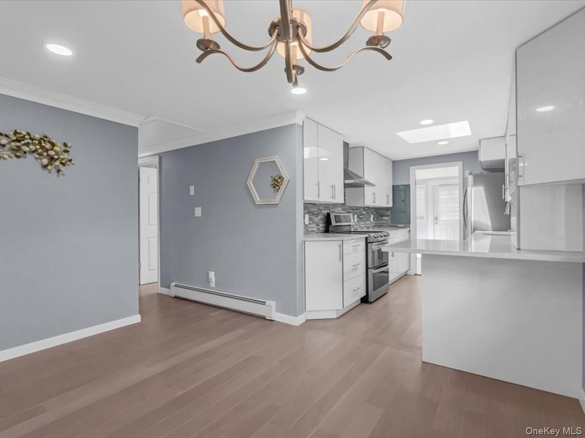 Welcome to this fully renovated ranch-style residence in the - photo 9