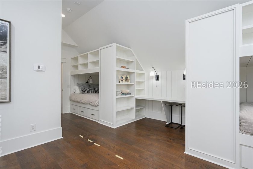 Gracefully positioned on a half-acre homesite overlooking one of - photo 35
