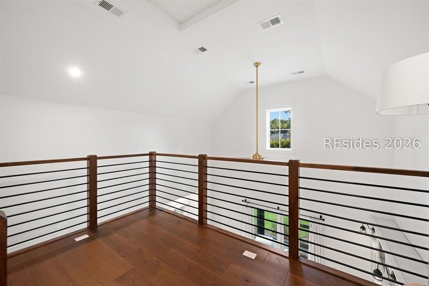 Gracefully positioned on a half-acre homesite overlooking one of - photo 45