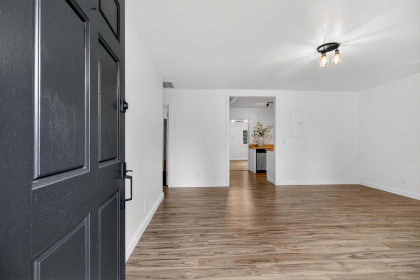 NEWLY REMODELED HOME WITH TWO GARAGES!Welcome to this charming - photo 4