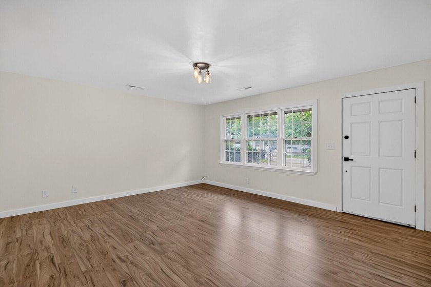 NEWLY REMODELED HOME WITH TWO GARAGES!Welcome to this charming - photo 6