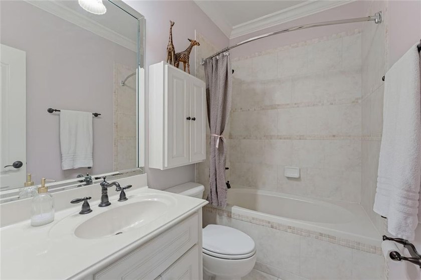 Nestled on a private cul-de-sac within the prestigious gates of - photo 25