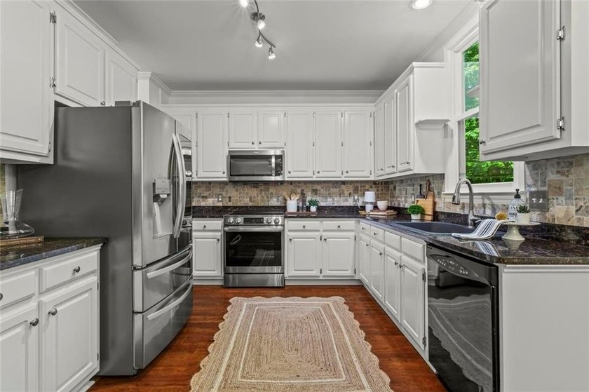 Over $150,000 in Seller Upgrades, on a stocked pond, in West - photo 12