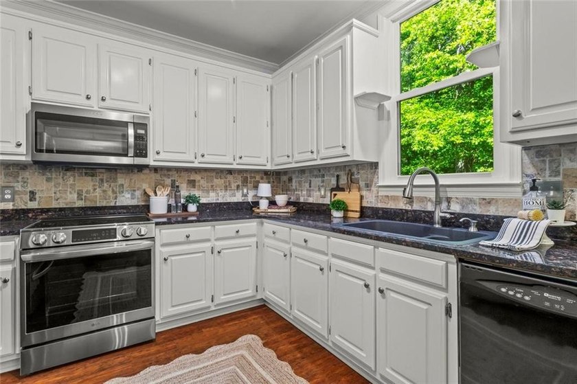 Over $150,000 in Seller Upgrades, on a stocked pond, in West - photo 14